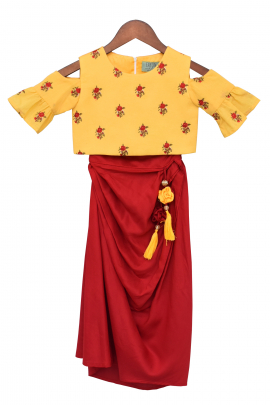 Yellow top with red dhoti skirt